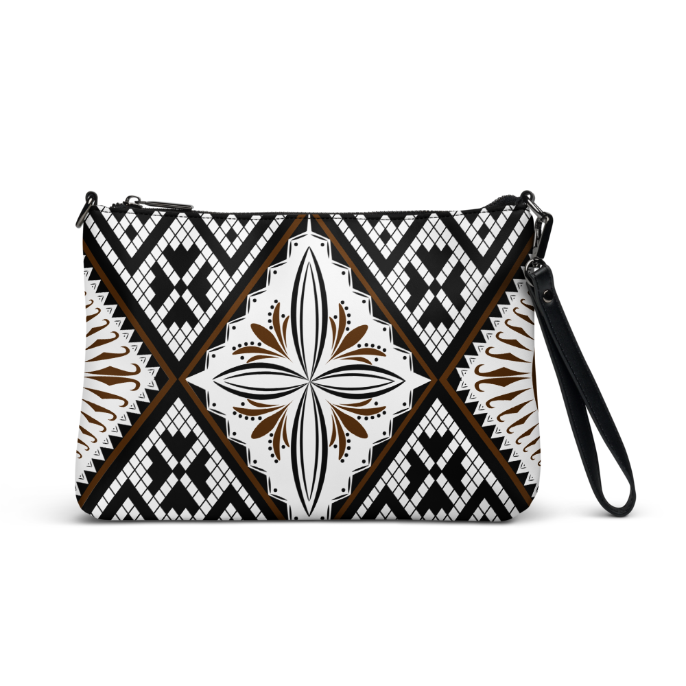 Ce sac à main en motif tapa est parfait pour vos soirées. Avec son look unique et sa pratique bandoulière, vous pourrez l'emporter partout avec style et facilité.